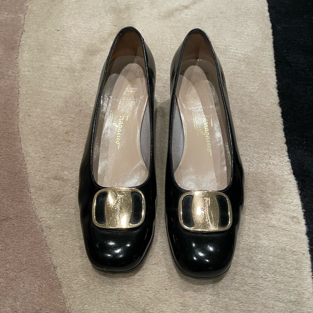 Beautiful Ferragamo black pumps with brass buckle.  Made in Italy.